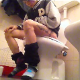 A short-haired brunette girl with dyed highlights sits down on a toilet while smoking a cigarette. She takes a shit, with some heavy plops and pissing sounds, although audio is somewhat muffled. Over 3 minutes.